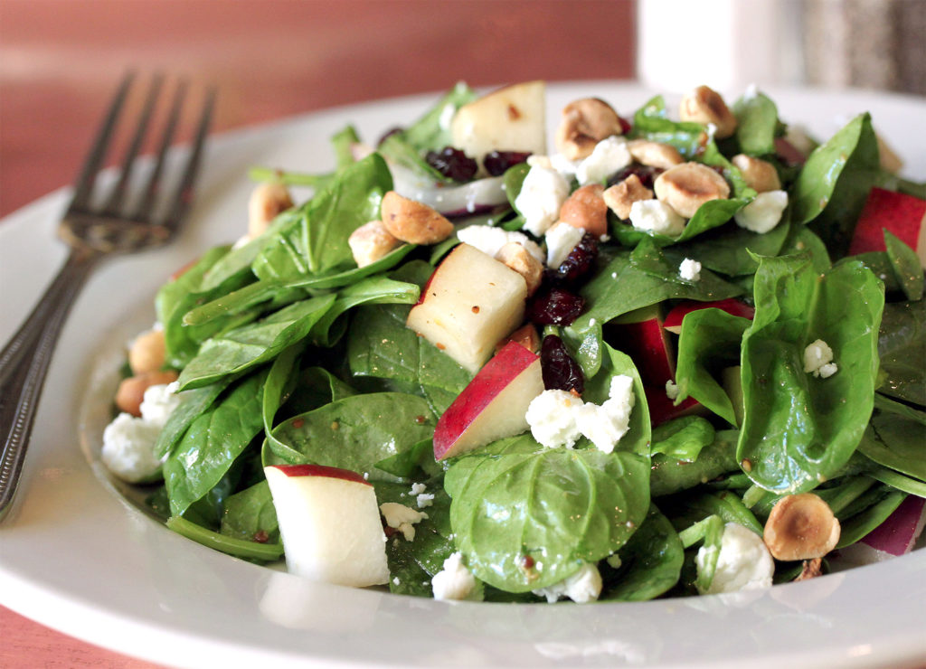 Spinach Salad with Bosc Pears, Cranberries, Red Onion, and Toasted Hazelnuts